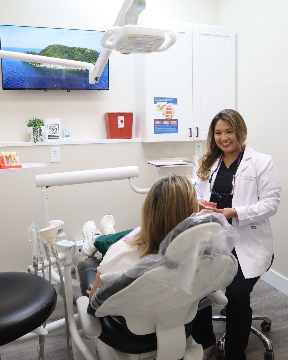 Dr. Ingrid R. Romero reviewing a smile design plan with a patient at Rovel Dental in Palm Springs, FL